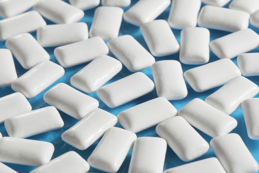 xylitol gum tablets on a blue background