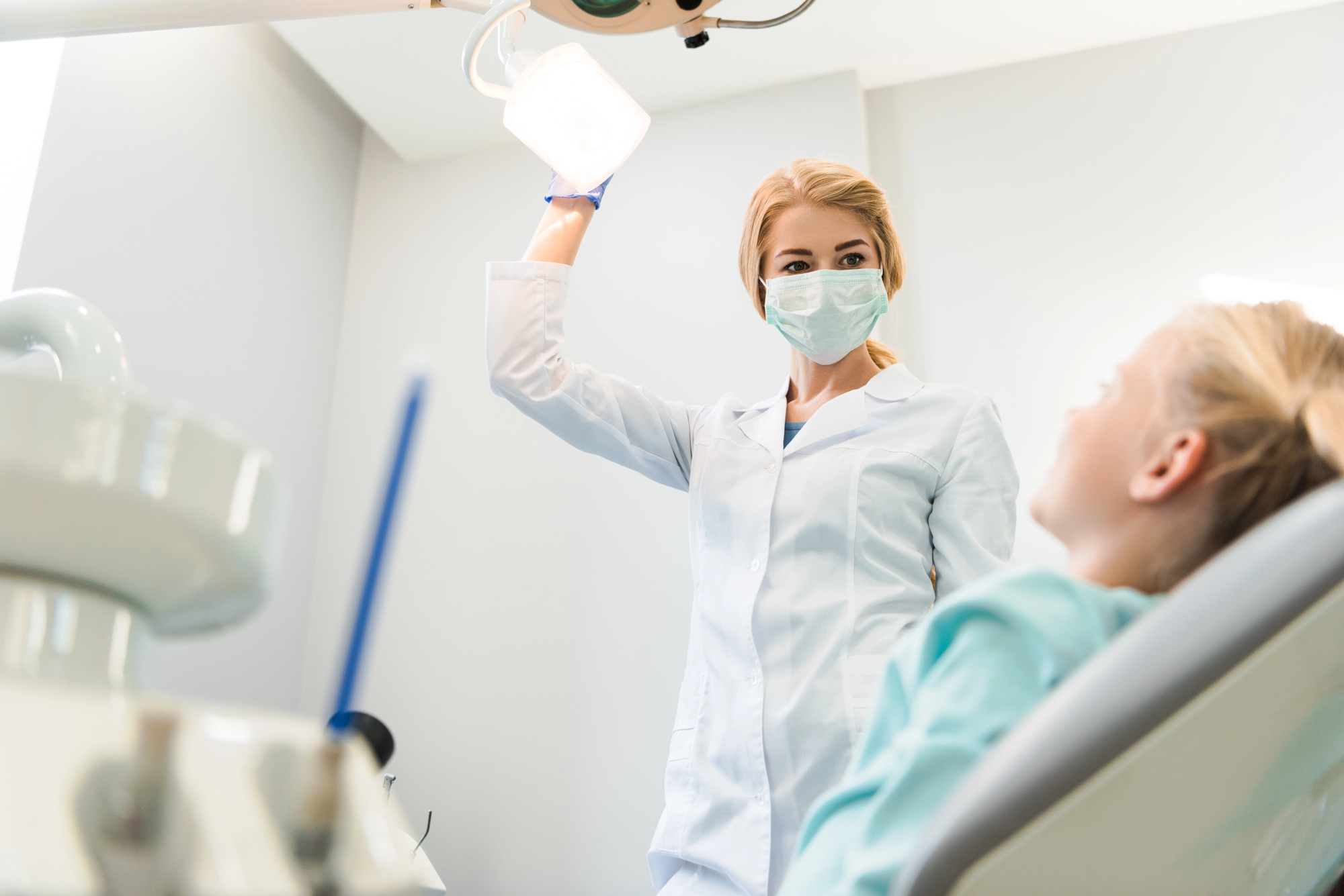 child at dentist getting dental sealants